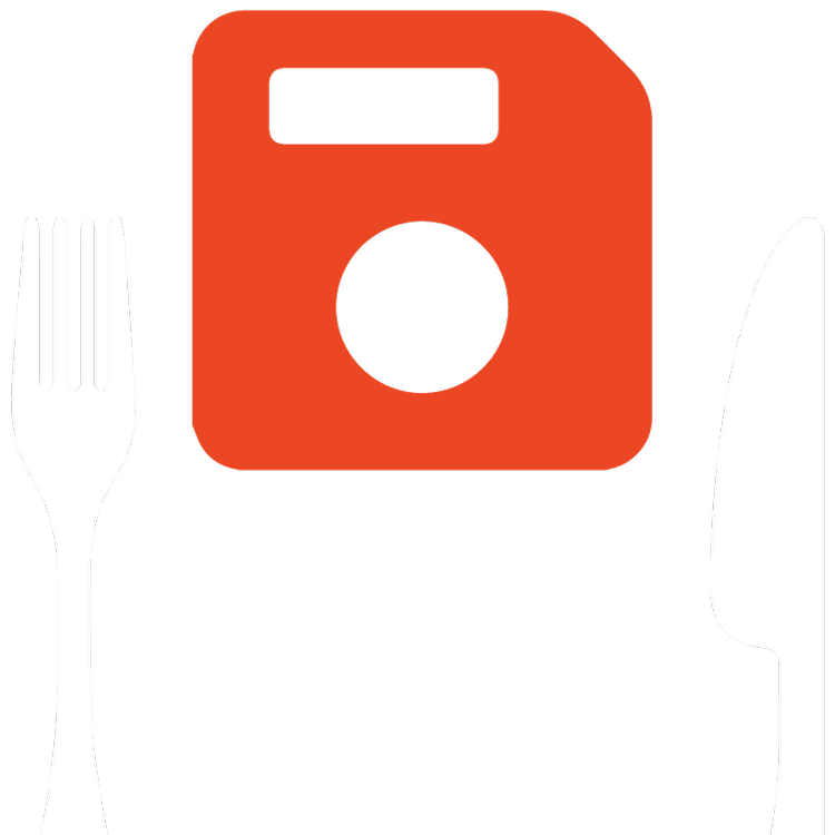 A red floppy-disk save icon between a white fork and knife on a black background